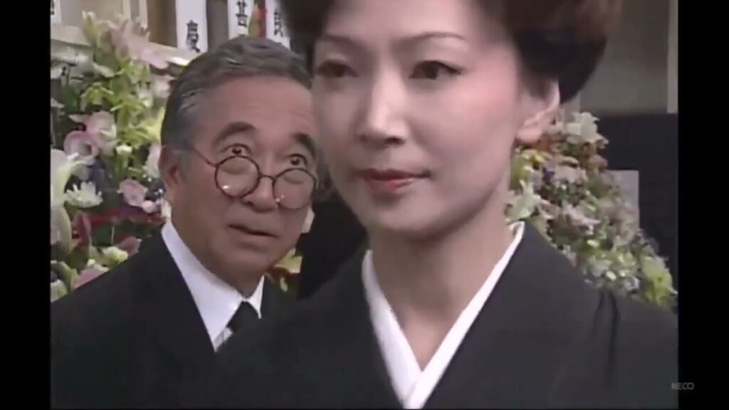 赤い霊柩車18  明子の経営する葬儀社で、代議士・片岡の生前葬を執り行うことになった