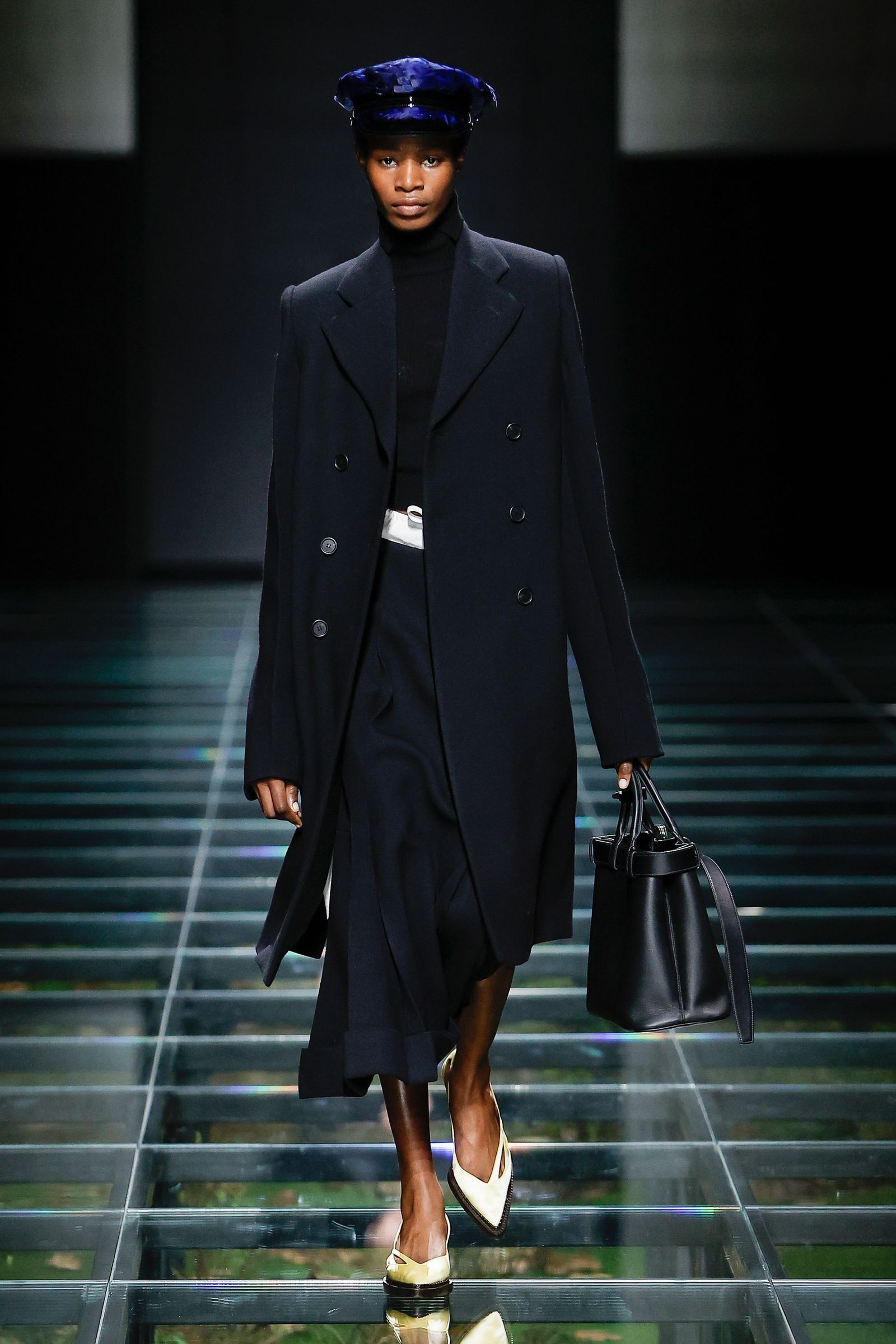 Image may contain Clothing Coat Accessories Bag Handbag Adult Person Fashion Footwear High Heel Shoe and Hat