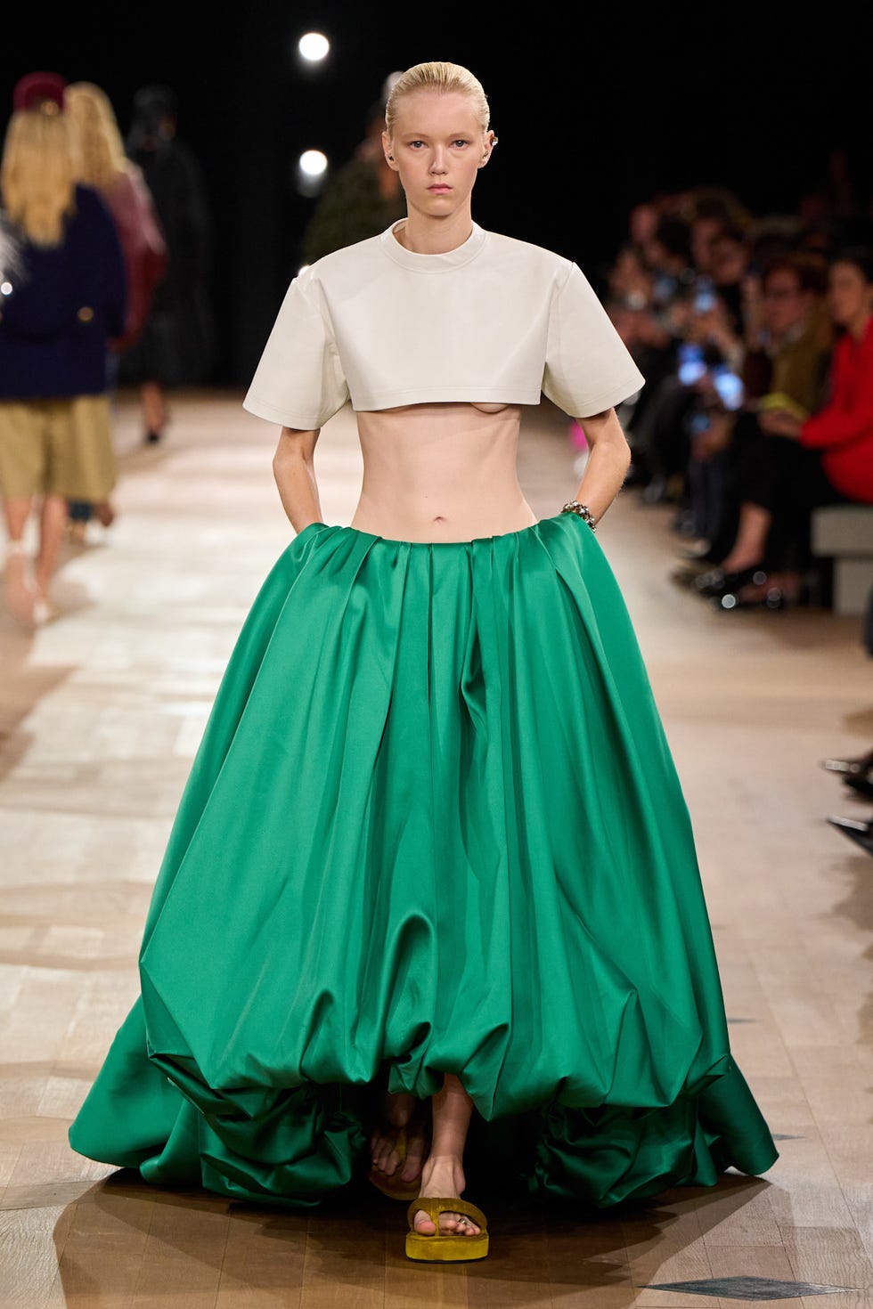 model showcasing a modern fashion ensemble on a runway