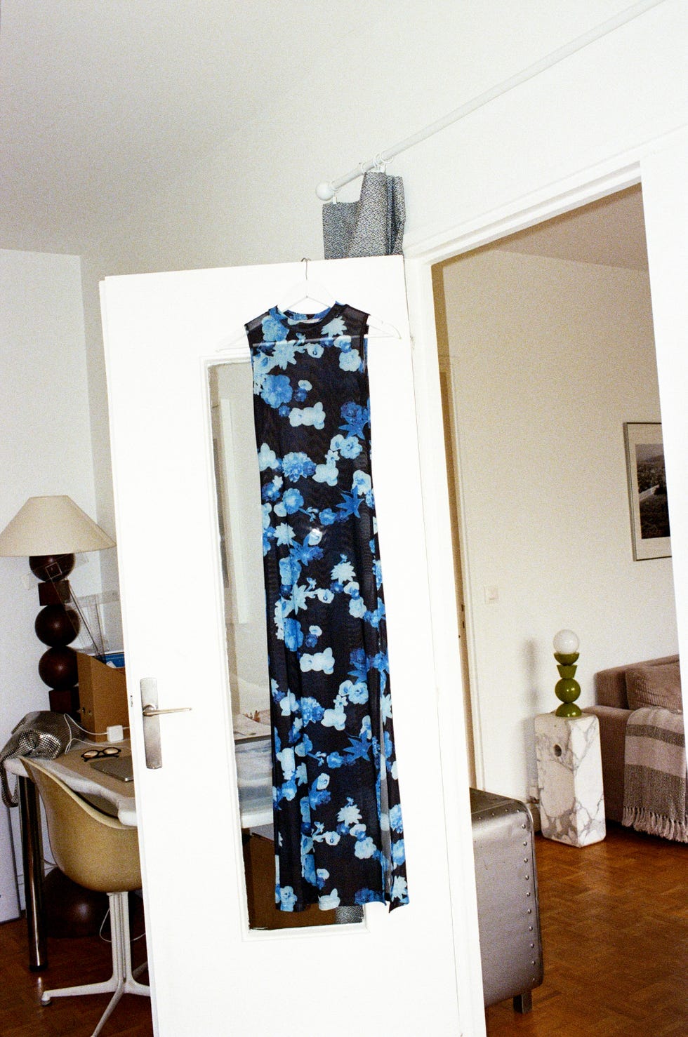 floral dress hanging in a room