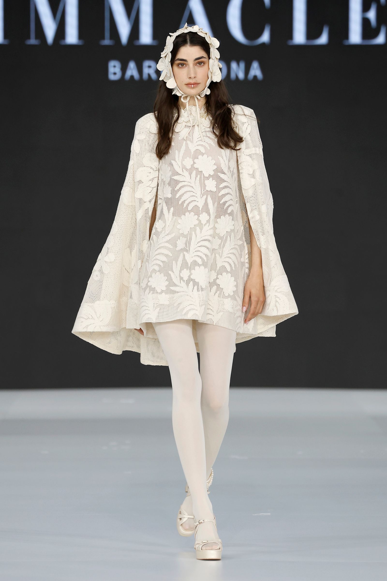 Image may contain Fashion Adult Person Clothing Dress Coat and Runway